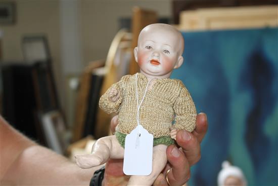 A Heubach character doll, intaglio eyes, 8in., a German all bisque baby, 4in. and a German character baby, composition body, 9in. (3)